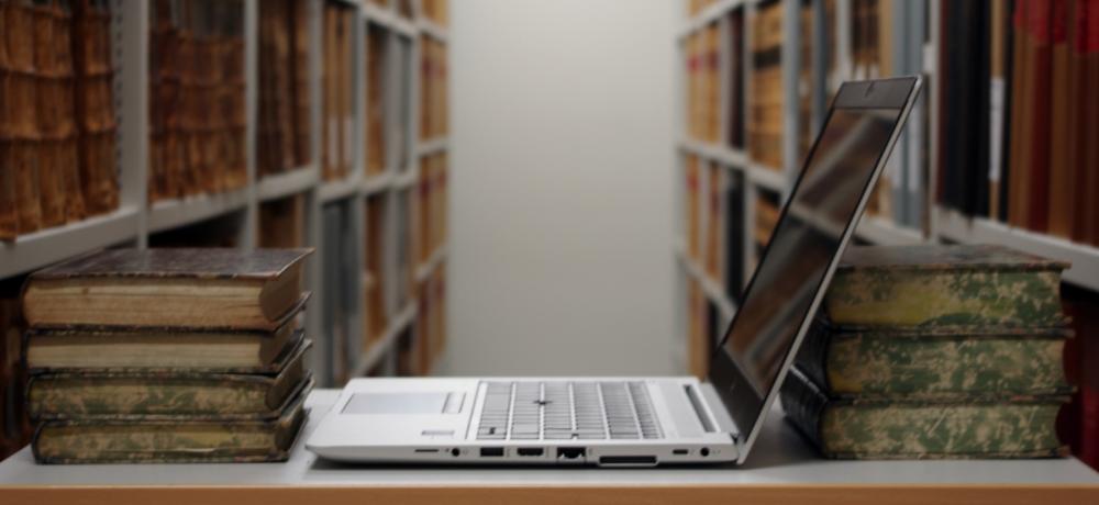 Computer and books on a desk